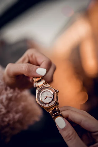 Stylish watch in woman hands