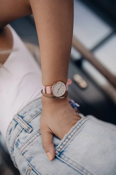 Stylish white watch on woman hand