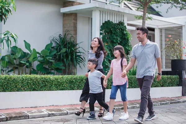 Young happy asian family walking together — Stock Photo, Image