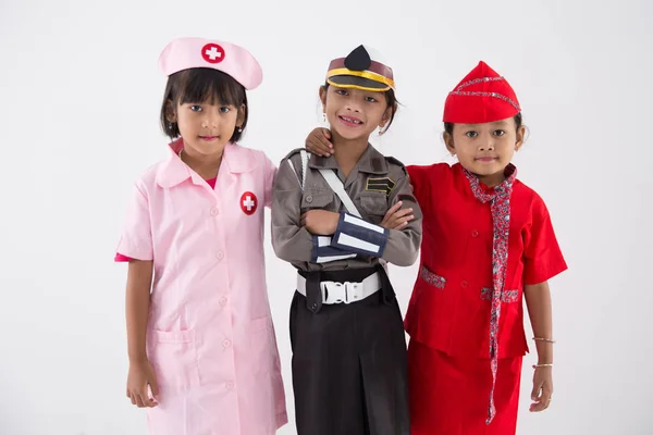 Drie meisje in verschillende beroep uniform — Stockfoto