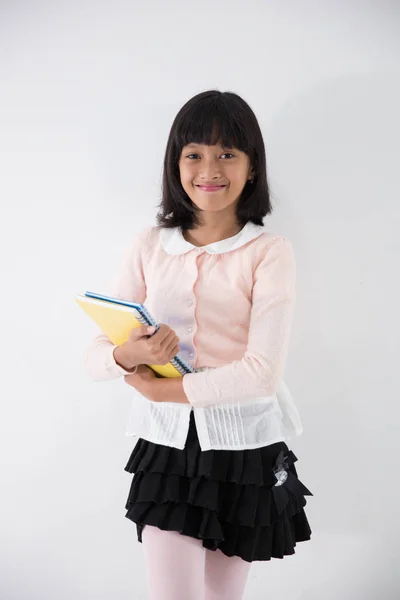 Μικρό κορίτσι φοιτητής με βιβλία — Φωτογραφία Αρχείου