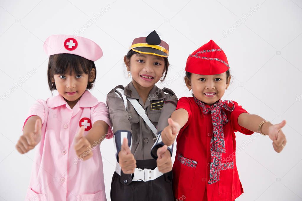 three little girl in different profession uniform