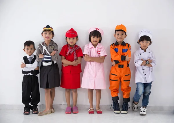 group of kids with diverse multi profession uniform on white background together