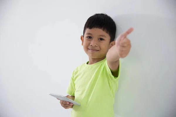 Young little boy using smart phone — Stock Photo, Image