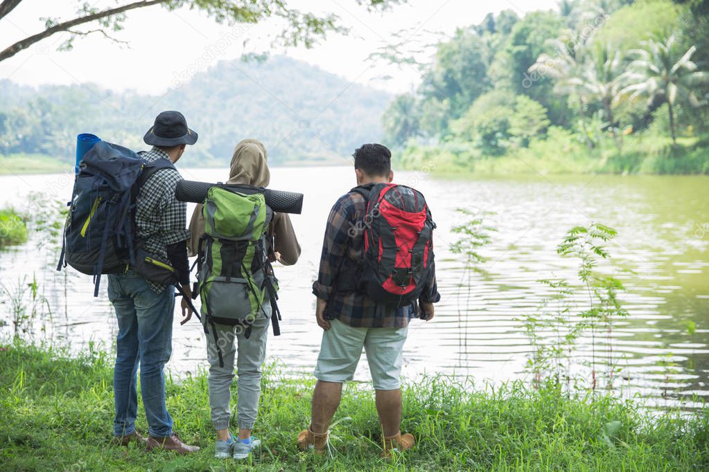 friends hiking in outdoor summer activity