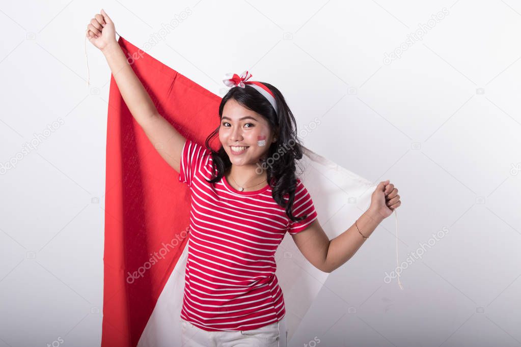 happy smiling young asian woman with indonesian flag
