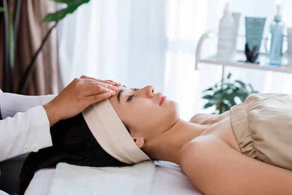 Close up woman enjoying massage — Stock Photo, Image