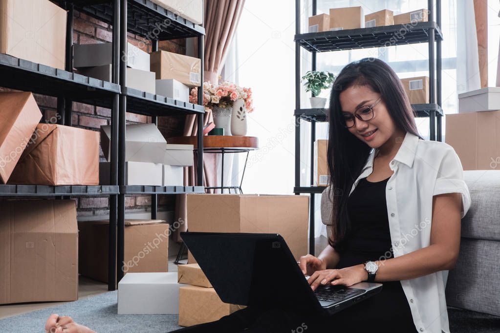 asian woman check shipping packages