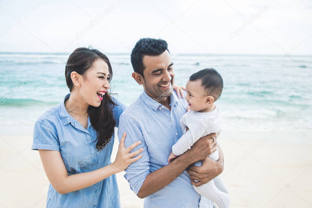 happy little family vacation on the beach