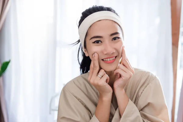 Young woman enjoying self face  massage — Stock Photo, Image