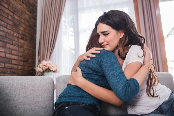 Friend calming her friend by giving a hug and embrace — Stock Photo, Image