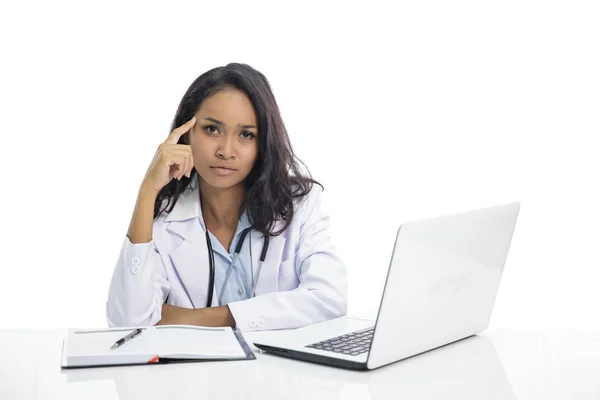 Asian young doctor  with flat expression while sitting on her wo — Stock Photo, Image