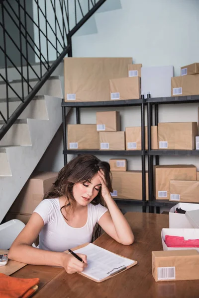 female business owner stress while working at home