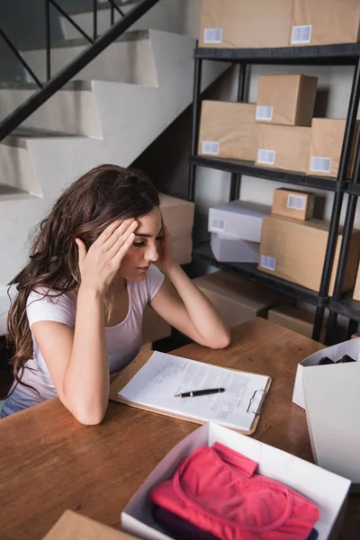 female business owner stress while working at home