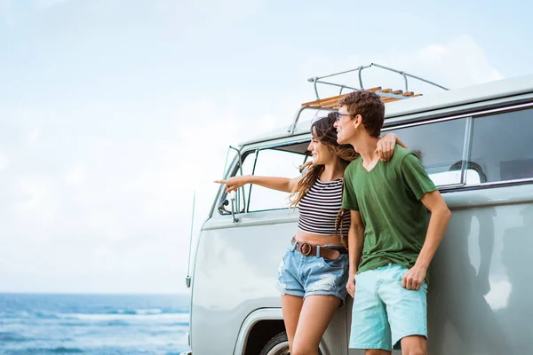 young couple cheerful and smiling while leaning at their retro s