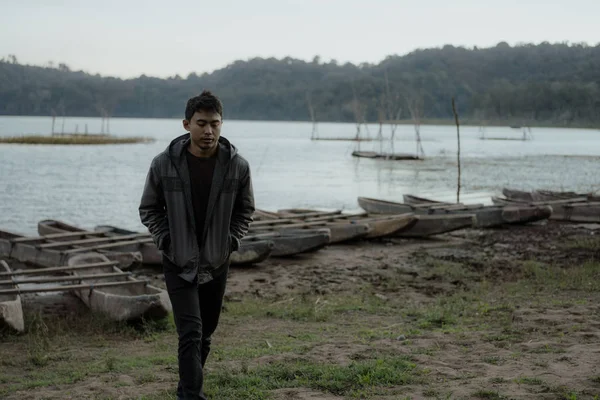 Young asian male walking in nature — Stock Photo, Image