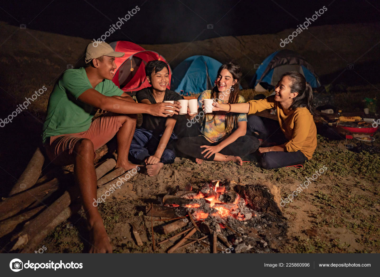 Portrait group of friends camping, cheering with cup of coffee — Stock