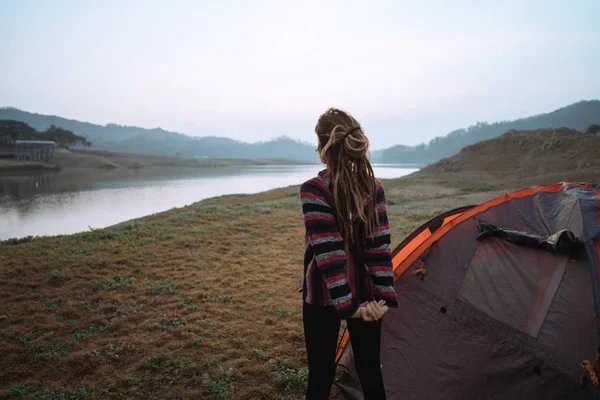 Portrait woman stretching side a tent — Stock Photo, Image