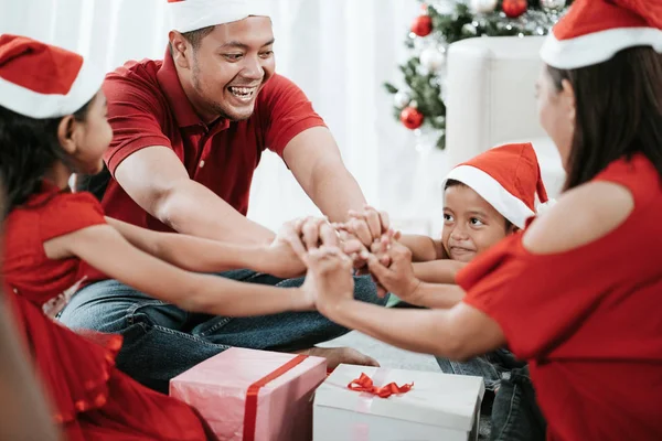 Asian family put their hands together — Stock Photo, Image