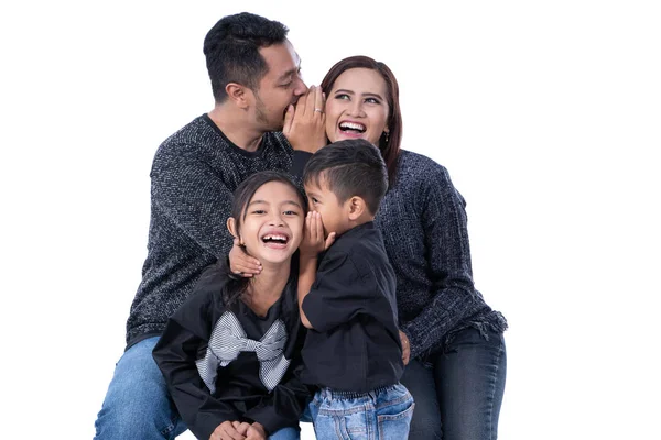 Kid whispering something to parents — Stock Photo, Image