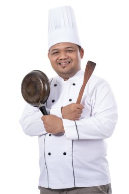 usta şef poz portresi pan ve spatula ile el geçti