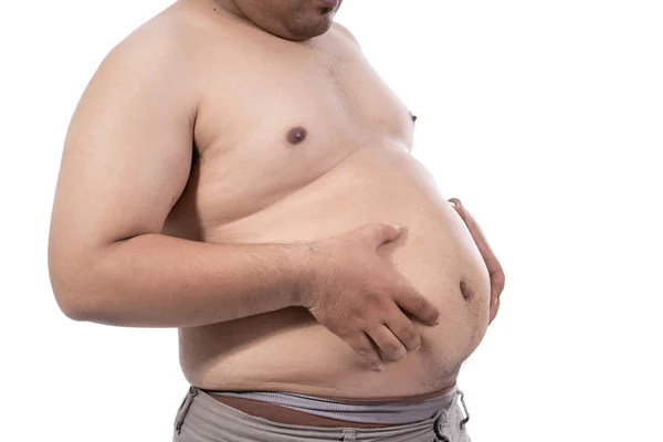 Portrait of fat young man pinch excess fat that has around his waist — Stock Photo, Image
