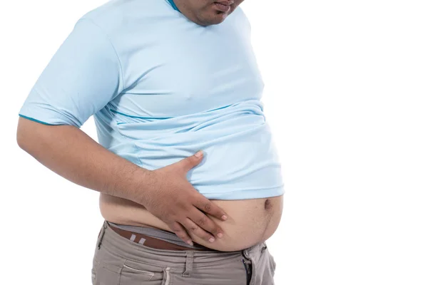 Portrait of fat young man pinch excess fat that has around his waist — Stock Photo, Image