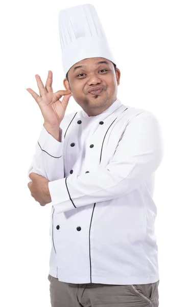 Portrét asijské mladé šéfkuchaře delicious gestem — Stock fotografie