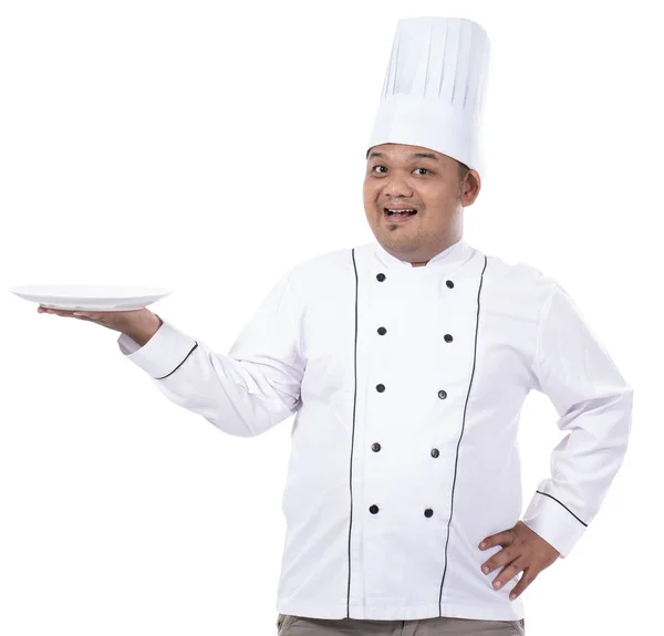 Retrato de chef segurar placa com a mão enquanto sorriso rosto — Fotografia de Stock