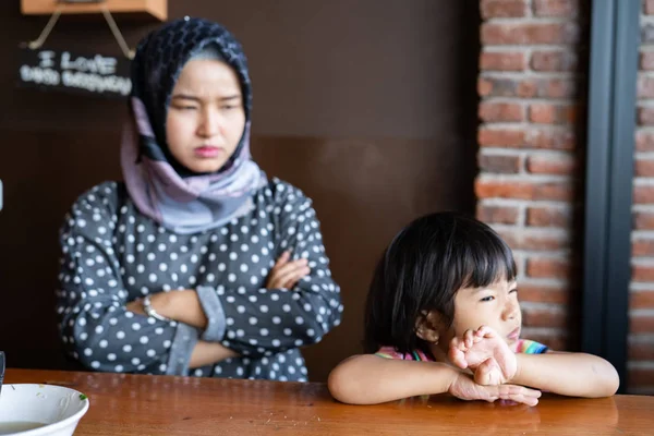 Sad kid and mad, mother at the back — Stock Photo, Image