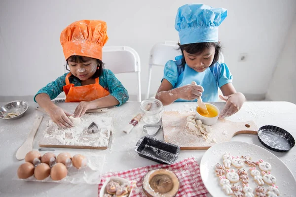 two girls toddler learn cooking and make some dough