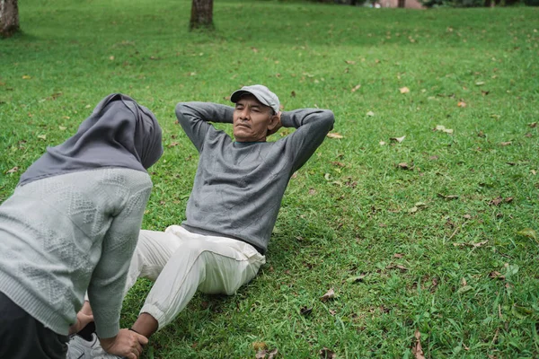 senior couple exercising in nature