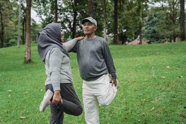 senior couple exercising in nature