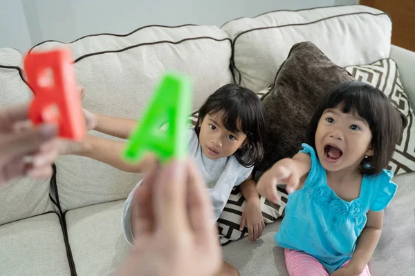 Learning alphabet while playing at home — Stock Photo, Image