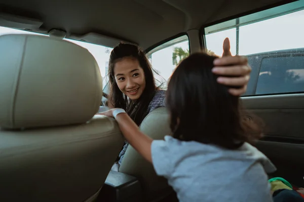 Portrait of young asian mother driving a car — Stock Photo, Image