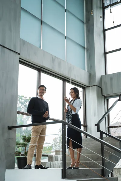 business people walking on stairs in the office