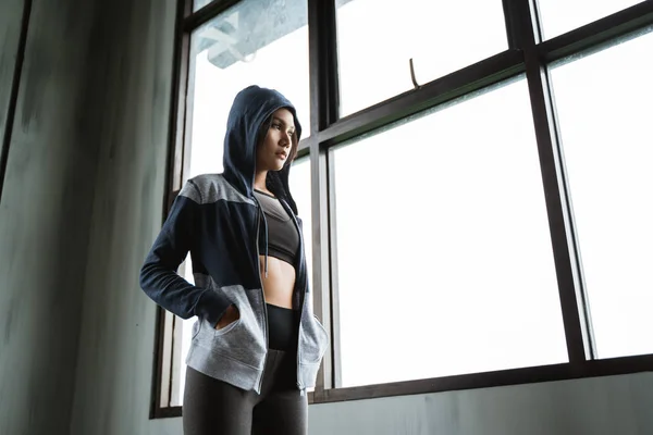 Pose of active woman wearing jacket after workout — Stock Photo, Image