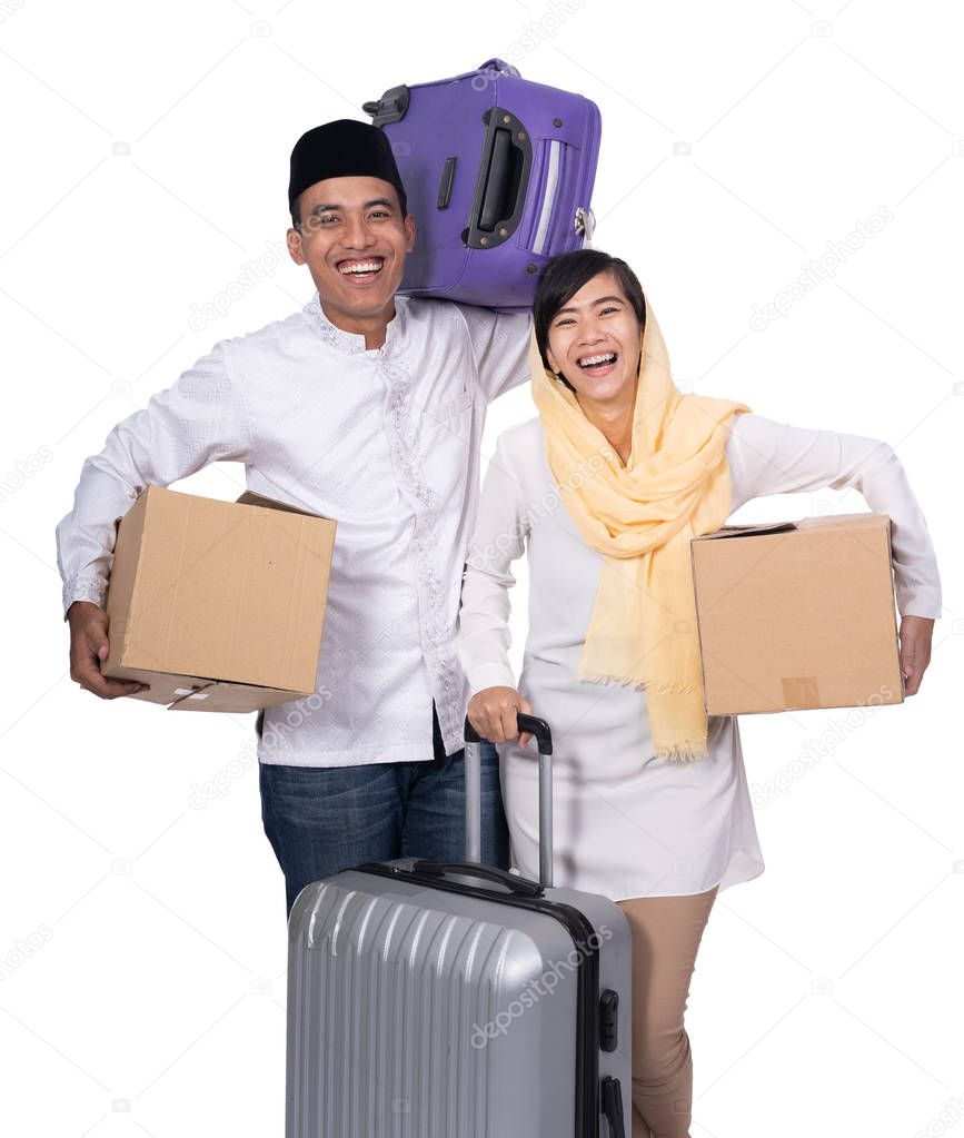 muslim asian couple with travel suitcase