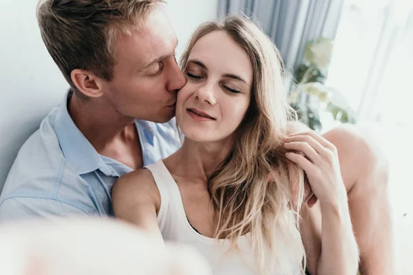 Young lovely couple kissing when take selfie together — Stock Photo, Image