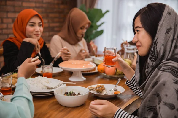 muslim people having dinner break fasting together