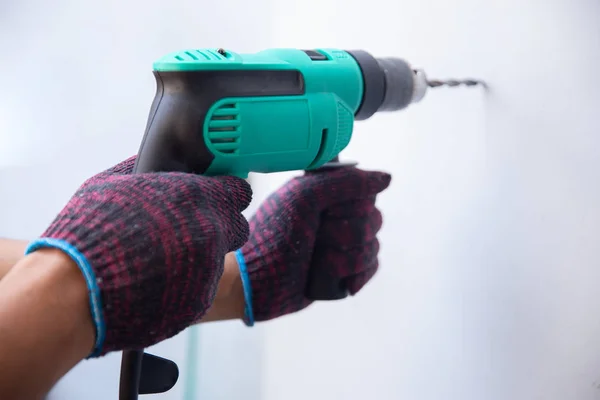 Handyman with drill — Stock Photo, Image