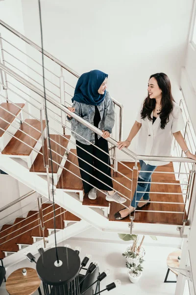 young business people in casual shirt talking on stair