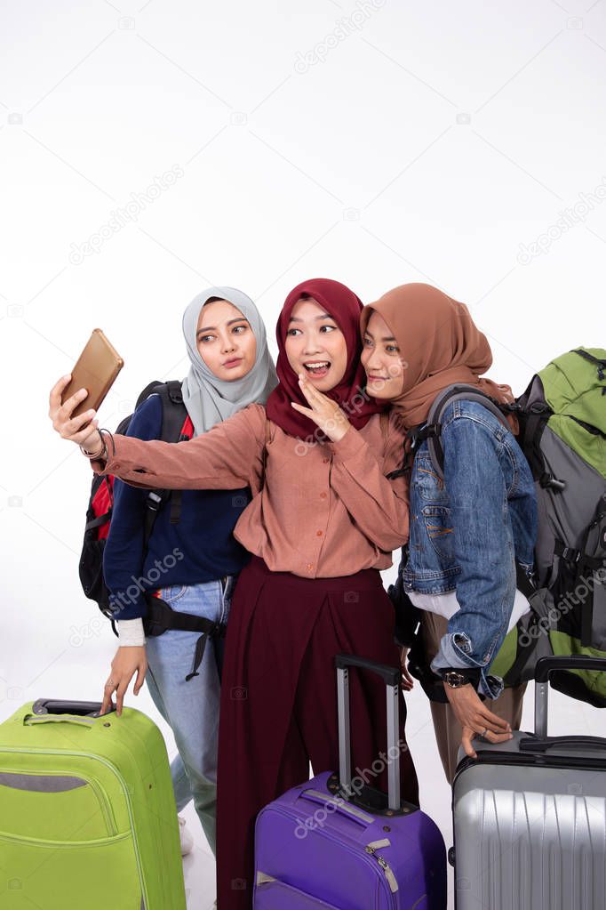 woman going vacation holding suitcase take selfie