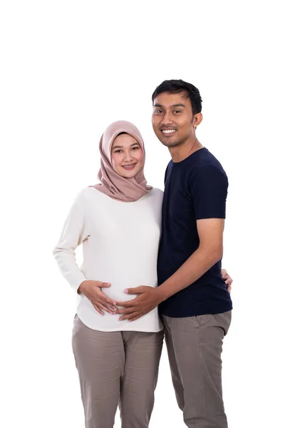 Muslim couple when wife pregnant with isolated background — Stock Photo, Image