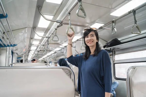 woman in train enjoy the trip