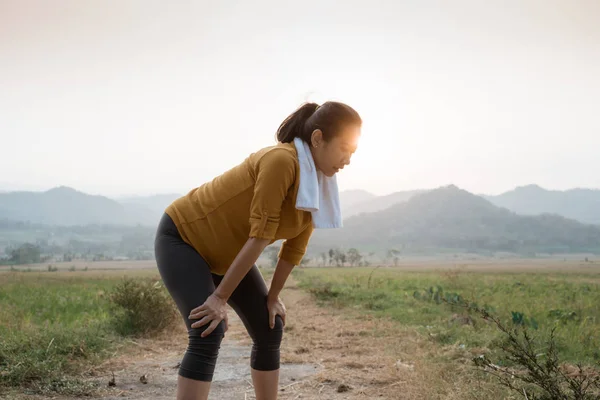 maternity woman take a break after workout outdoor