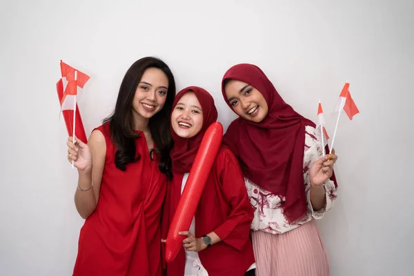 indonesian woman with flag celebrating independence day