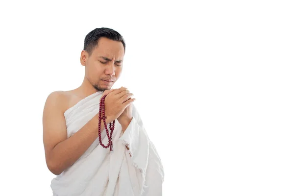 Muslim man praying in white traditional clothes — Stock Photo, Image