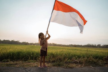 asya küçük kız Endonezya bayrağı çırpan