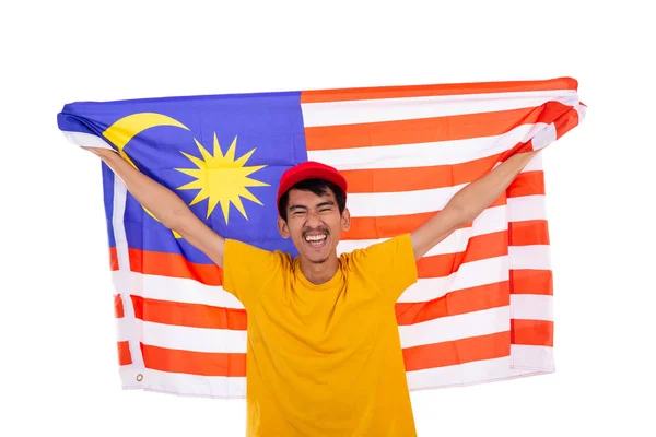 Ásia jovem masculino segurando malásia bandeira — Fotografia de Stock